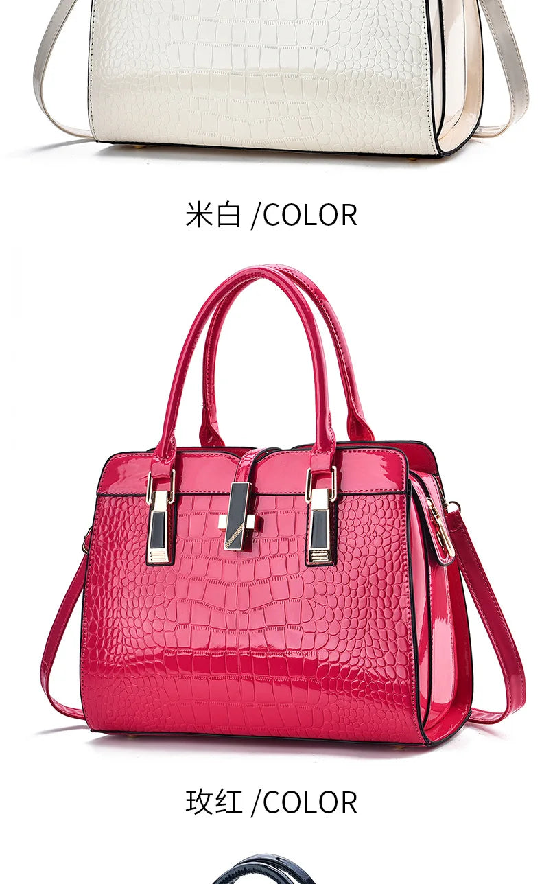 Hot pink crocodile-pattern patent leather handbag with dual top handles and gold-tone hardware closures.