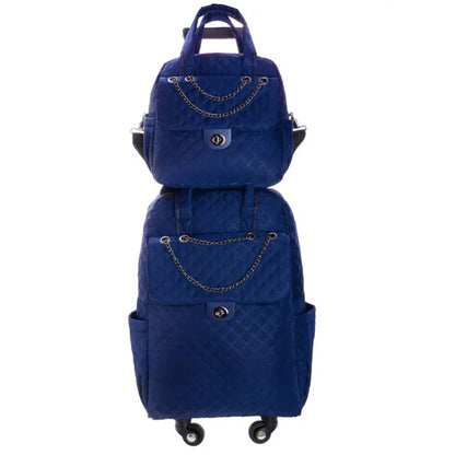 Blue quilted rolling backpack and matching handbag set with chain details and silver hardware.