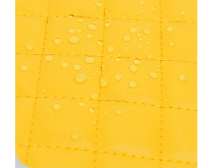 Water-resistant yellow quilted nylon fabric with water droplets beading on the surface.