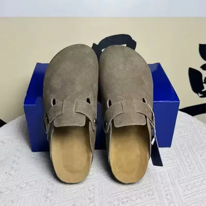 Taupe rubber mules with an adjustable buckle strap and non-slip sole for comfortable beach wear.