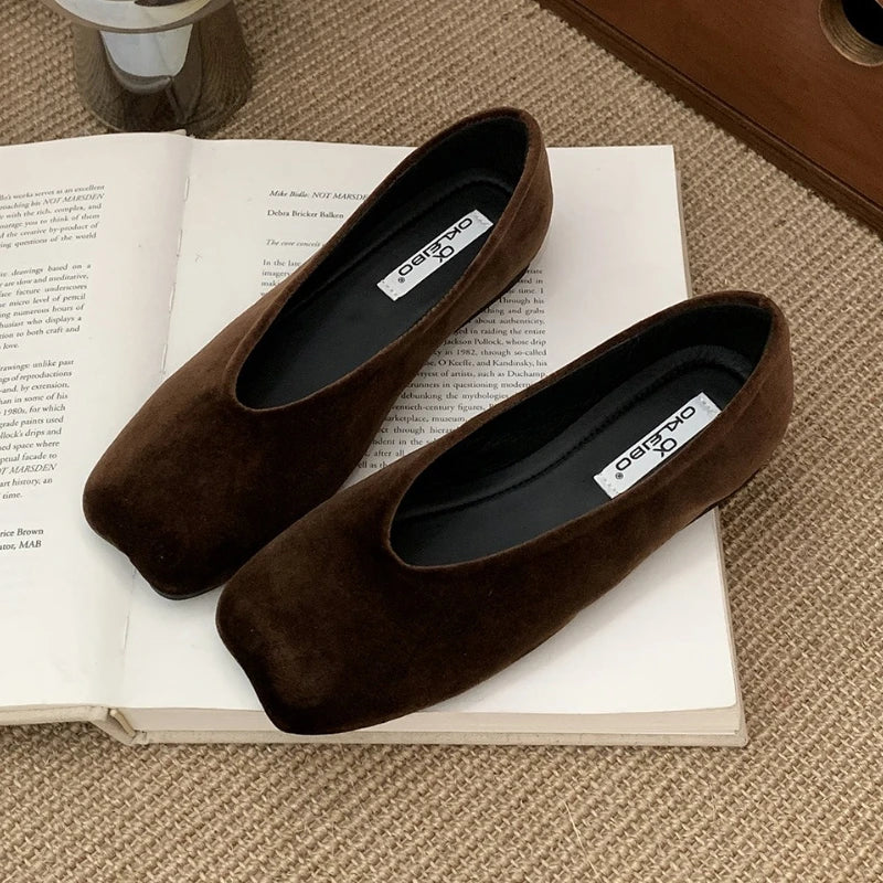 Dark brown suede slip-on flats with square toes and cushioned insoles for everyday wear.