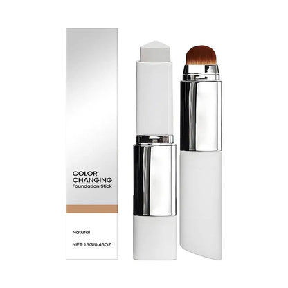 Foundation stick with built-in makeup brush and color-changing formula in white and silver packaging