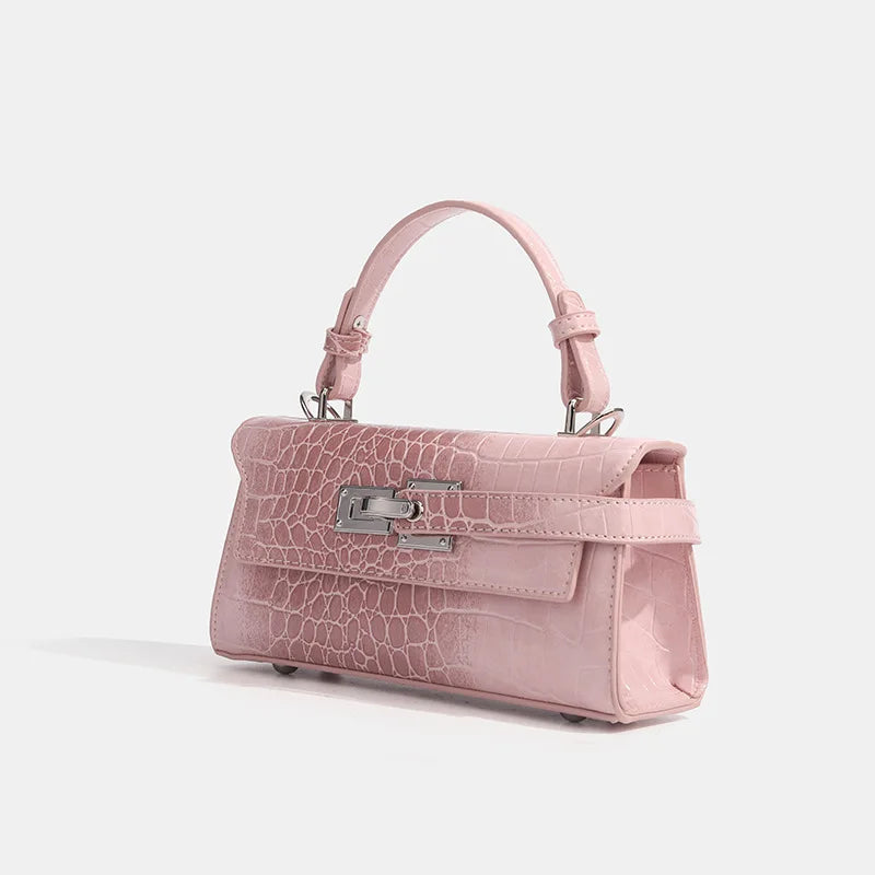 Light pink faux leather crossbody with croc texture, silver hardware, and zip closure for daily essentials.