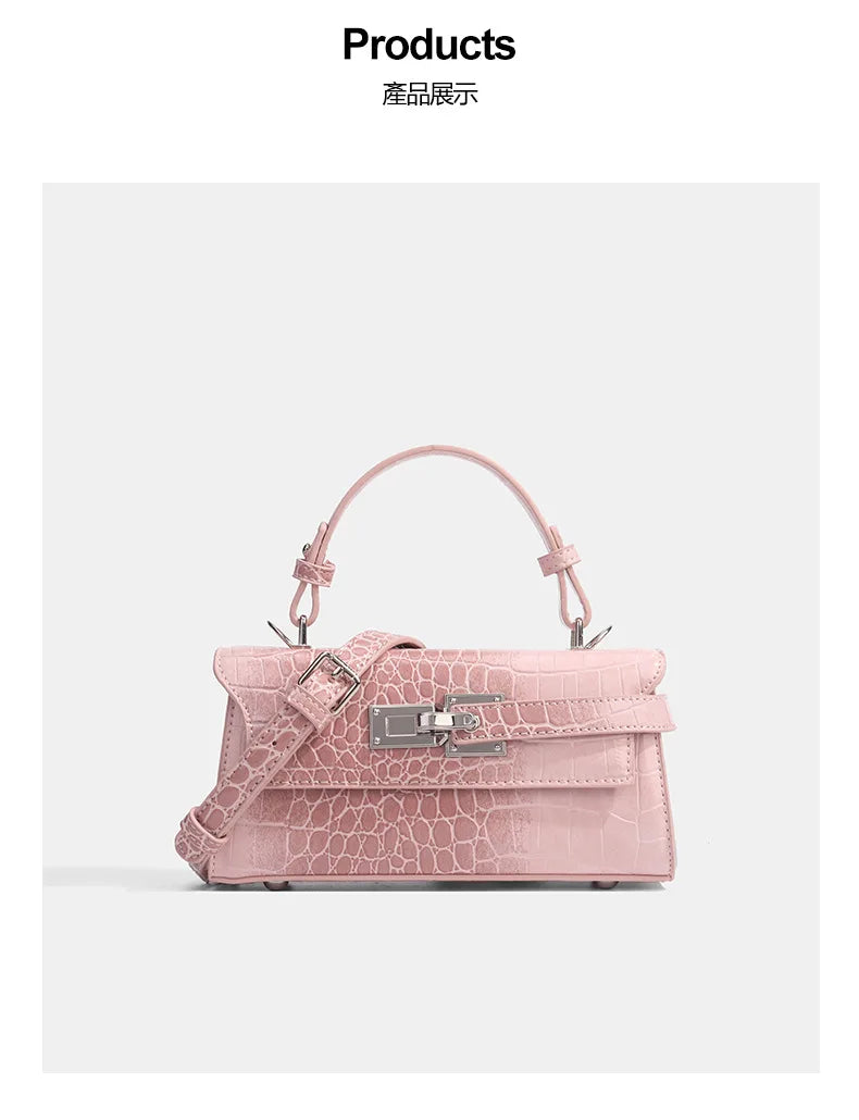 Pink faux leather crossbody bag with croc texture, silver clasp, and adjustable strap for daily errands.