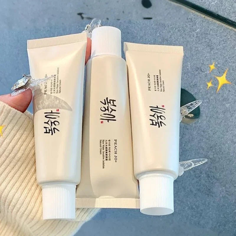 Three off-white squeeze tubes of SPF50+ Rice Extract Moisturizing Cream with black text.