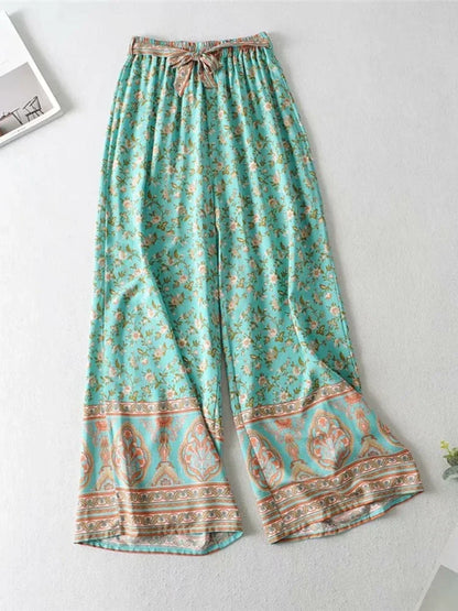 Teal floral flowy wide leg pants with a drawstring waist, comfortable for casual summer outfits.