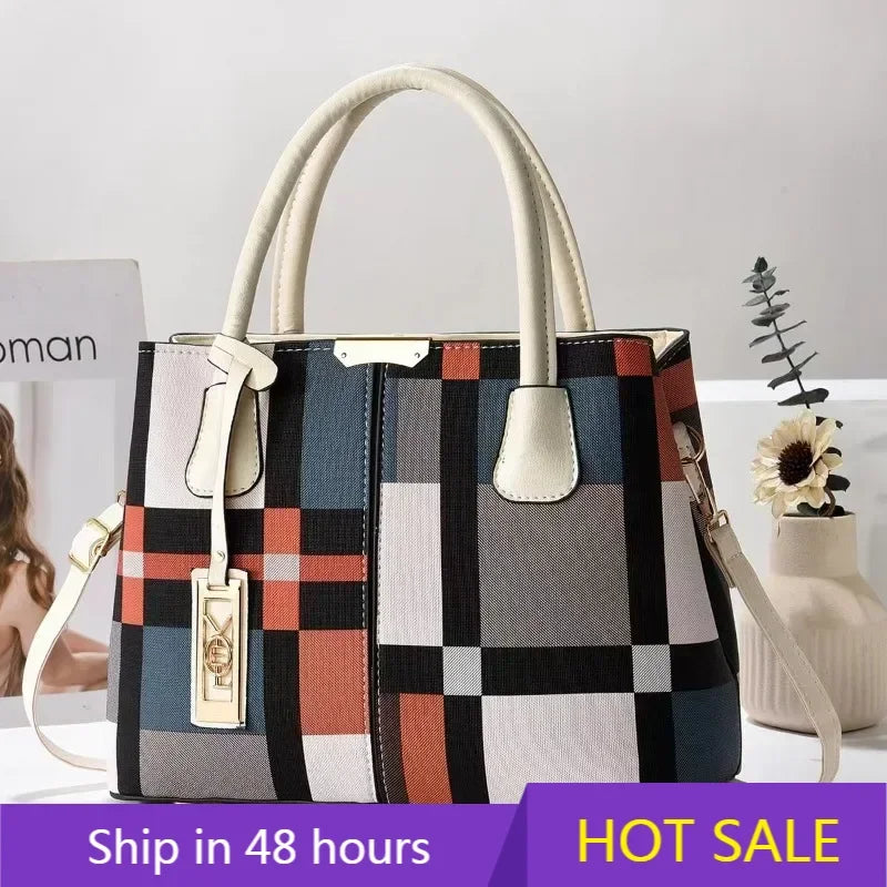 Multicolor plaid structured tote bag with zip closure and adjustable strap for everyday use.