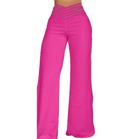 Bright pink high-rise wide-leg pants featuring a sheer mesh crossover striped waistband.