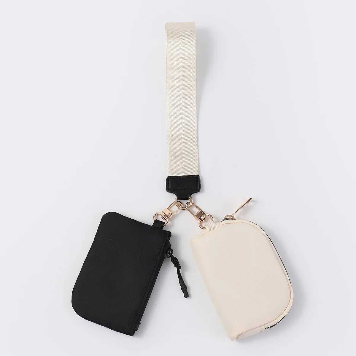 Black and beige nylon dual pouch with a wrist strap, zip closure, and clips for daily essentials.