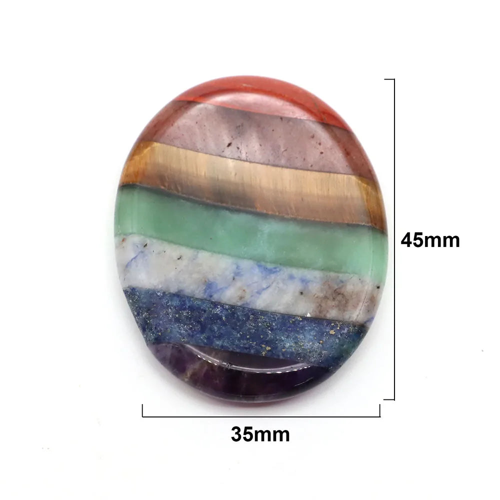 Smooth oval palm stone with multi-color striped natural crystals for meditation home decor.