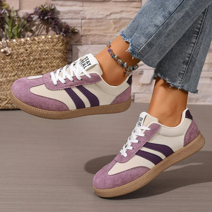 Purple and cream leather slip-on sneakers with gum soles for casual daily wear.