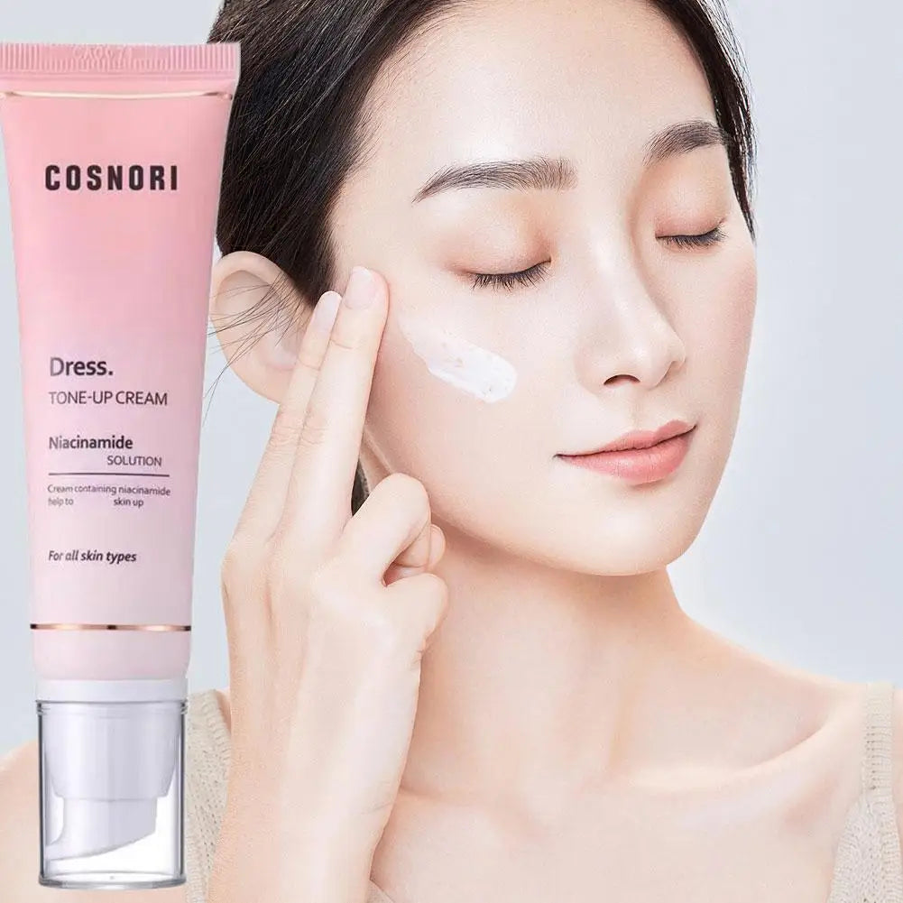 Tone up cream brightening makeup base daily moisturizer containing niacinamide applied to facial skin