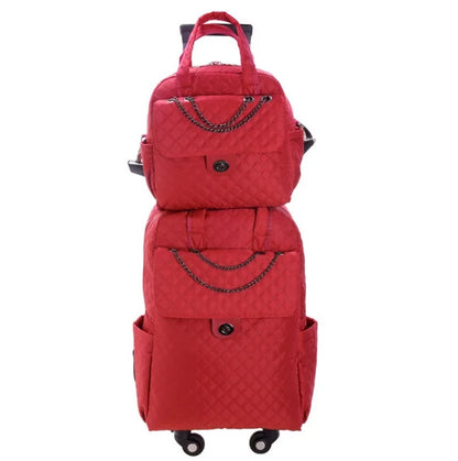 Red quilted nylon rolling backpack and matching handbag set with chain accents and black hardware.