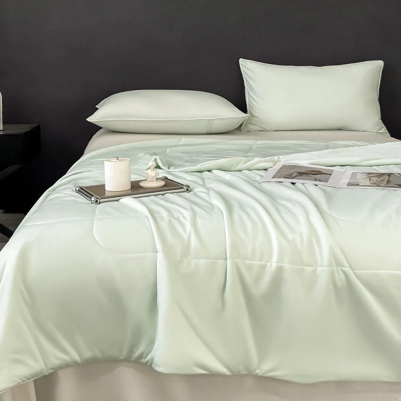 Light green, smooth fabric cooling comforter for bedding & bath provides a soft, breathable layer for hot sleepers.