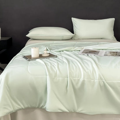 Light green, smooth fabric cooling comforter for bedding & bath provides a soft, breathable layer for hot sleepers.