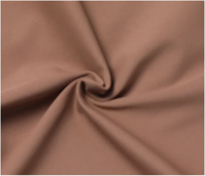 Swirled matte mocha polyester fabric of a stretchy women's sport jacket for gym training.