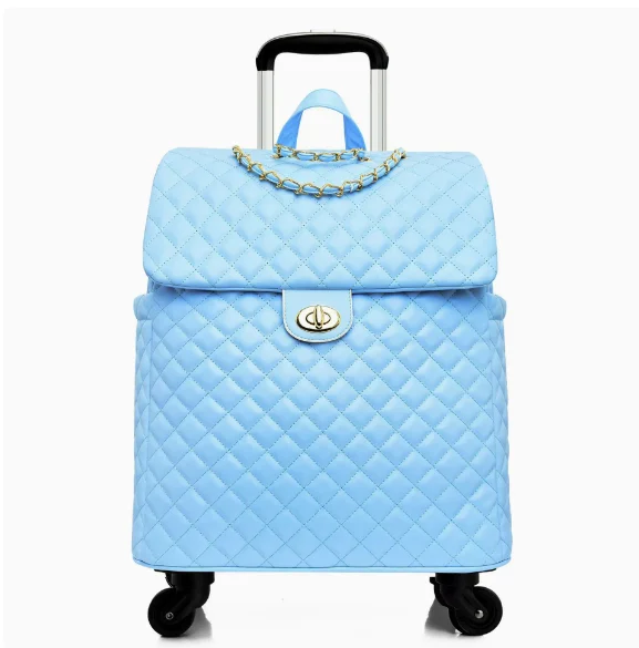 Light blue quilted leather rolling trolley suitcase with gold chain accent, turn-lock closure, and retractable handle.
