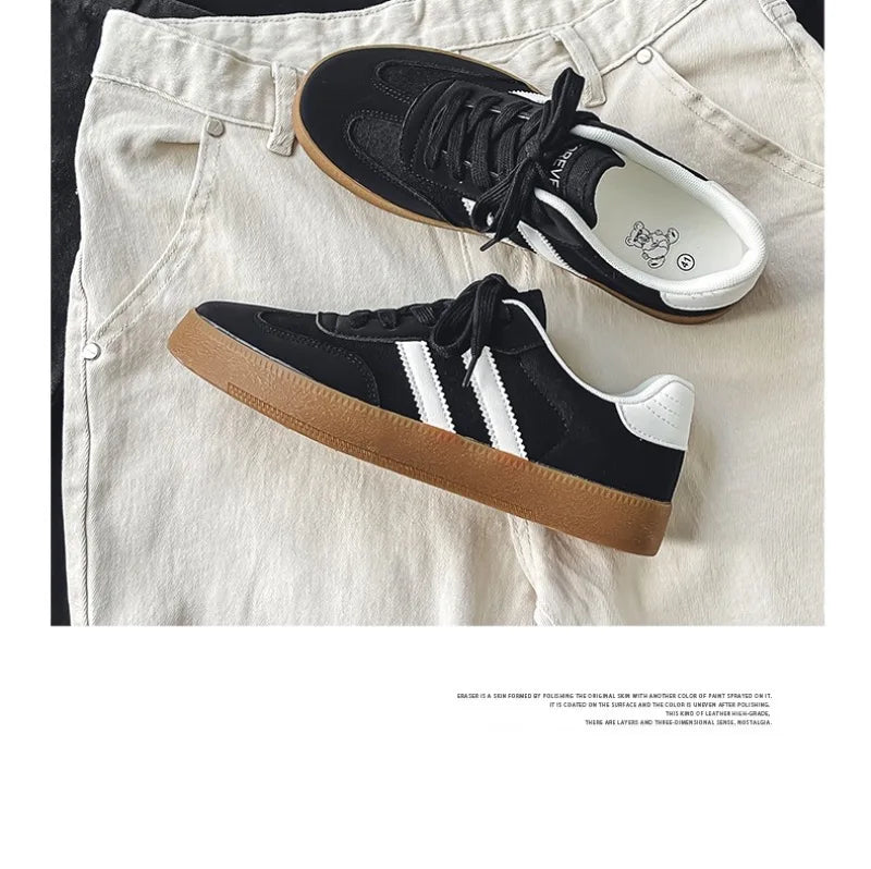 Black canvas sneakers with white stripes, white heel tabs, and gum soles, breathable casual training shoes for daily wear.