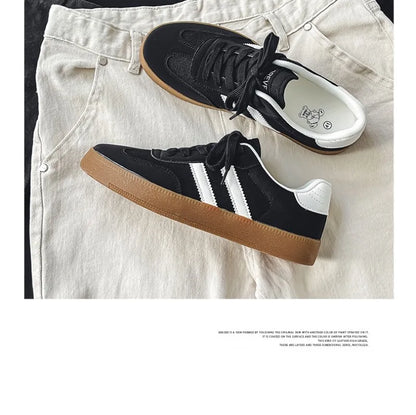 Black canvas sneakers with white stripes, white heel tabs, and gum soles, breathable casual training shoes for daily wear.