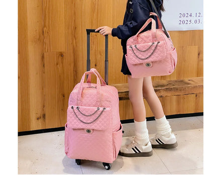 Pink quilted rolling backpack and matching handbag set with chain detail on front pockets.