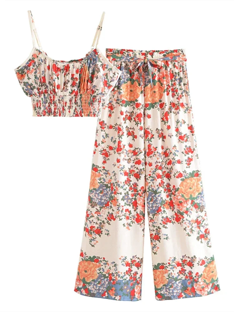 Cream floral flowy two-piece set with a smocked cropped camisole and drawstring wide leg clothing for summer outings.