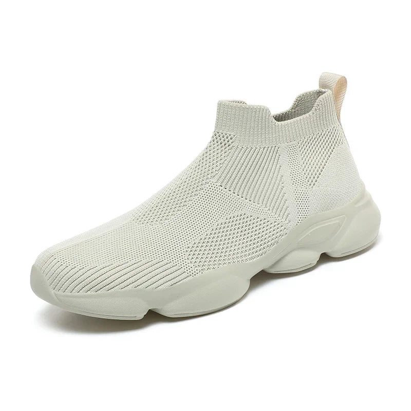 Beige knit slip-on sneaker with breathable fabric and a thick cushioned sole for casual daily wear.