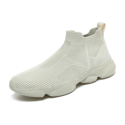 Beige knit slip-on sneaker with breathable fabric and a thick cushioned sole for casual daily wear.