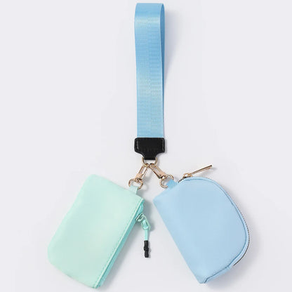 Light blue nylon waterproof wristlet wallet with dual pouches and zip closure for daily errands.