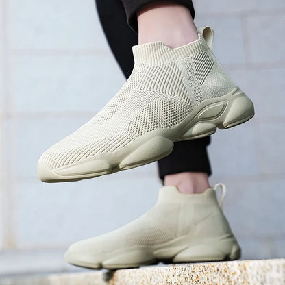 Beige slip-on moccasin sneakers with a breathable knit fabric and cushioned sole for everyday casual walking.