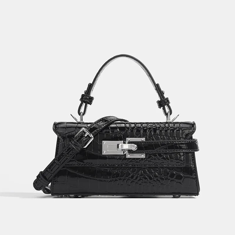 Black faux leather structured crossbody bag with silver hardware, adjustable strap, and secure zip closure.