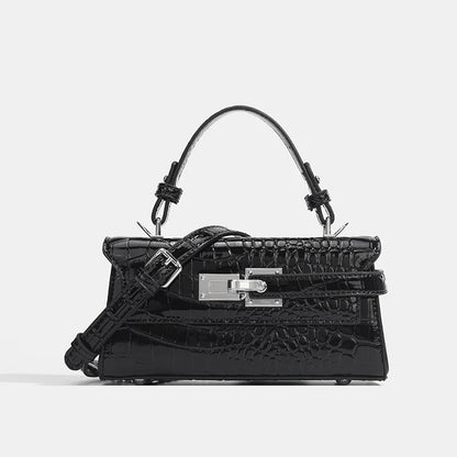 Black faux leather structured crossbody bag with silver hardware, adjustable strap, and secure zip closure.