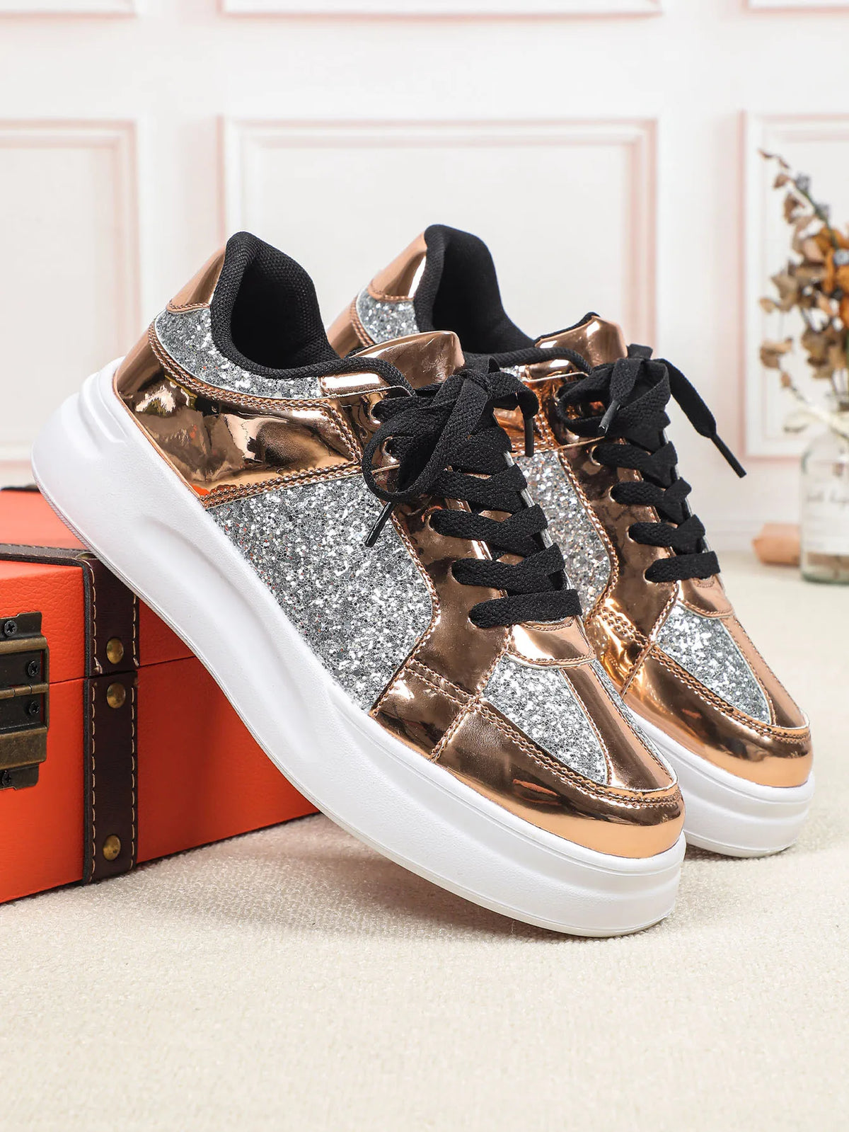 Rose gold and silver sequin casual sneakers with thick white soles and black laces.