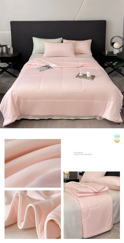 Soft pink cooling comforter with piped edges and breathable fabric for a comfortable night’s sleep.