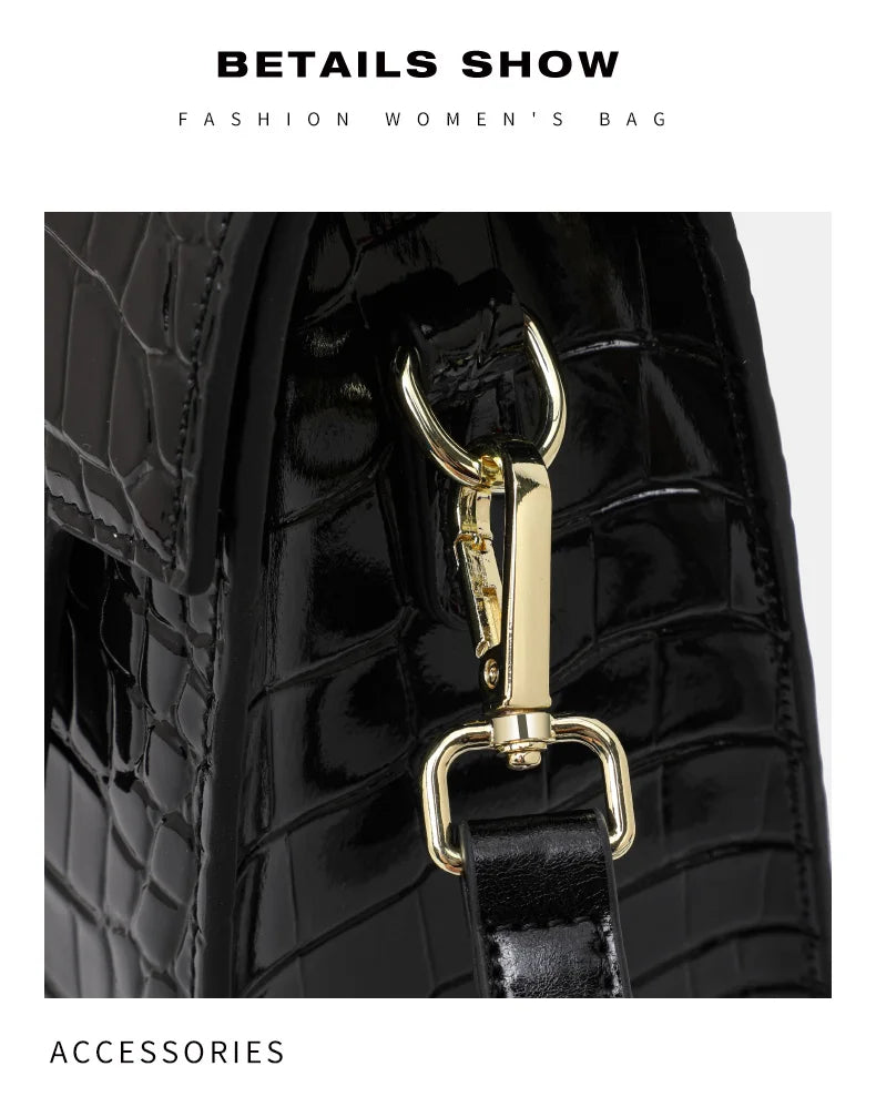 Black patent leather crocodile-pattern women's handbag with gold hardware and a strap clasp.