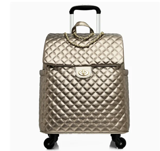 Metallic gold quilted rolling travel bag with a flap closure, turn-lock, gold chain detail, and telescoping handle.