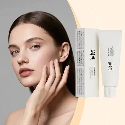 White 50g SPF50+ rice extract moisturizing cream tube and box with black text, next to a woman's face.