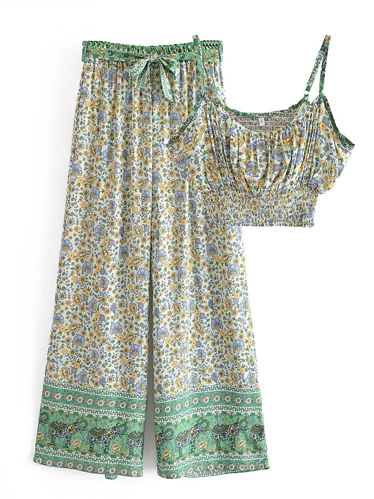 Flowy floral print two-piece set with wide leg drawstring pants and a smocked crop top for summer vacation outfits.