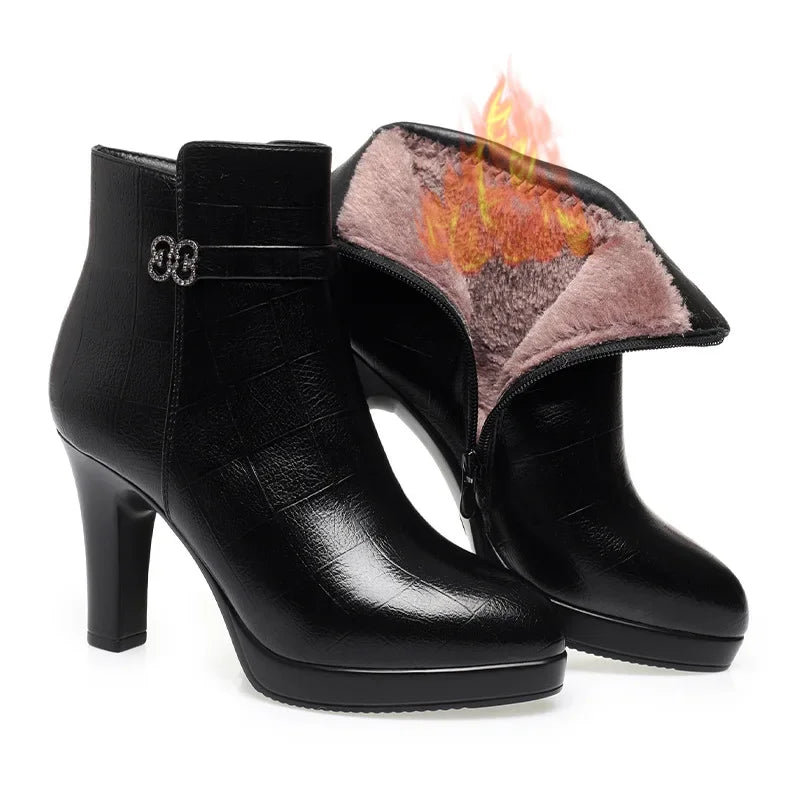 Black leather ankle boots featuring high block heels, platform soles, decorative buckle straps, and warm fur lining.