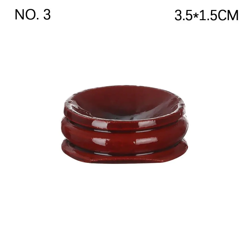 Dark reddish-brown glossy wooden crystal ball base stand with a rounded, tiered shape and a top indentation.