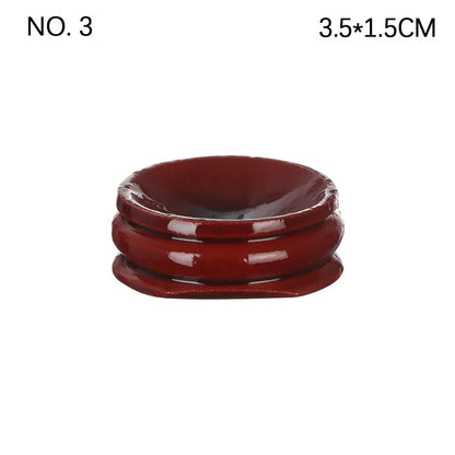 Dark reddish-brown glossy wooden crystal ball base stand with a rounded, tiered shape and a top indentation.