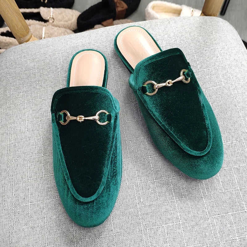 Dark green velvet slip-on shoes with gold chain hardware for all-day wear.