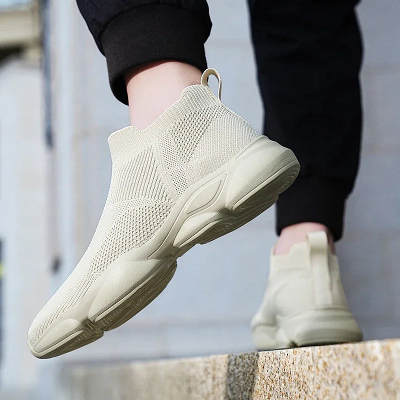 Beige knit slip-on sneakers with breathable textured design for comfortable daily wear.