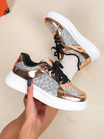Rose gold metallic and silver glitter sneakers with thick white soles and black laces.