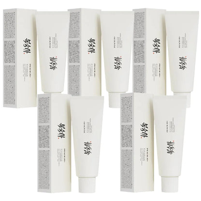 Four white 50g SPF50+ Rice Extract Moisturizing Cream tubes with matching boxes, featuring black Korean text.