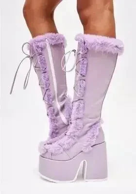 Purple mid-calf platform wedge boots with faux fur trim, side lacing, and chunky heels.