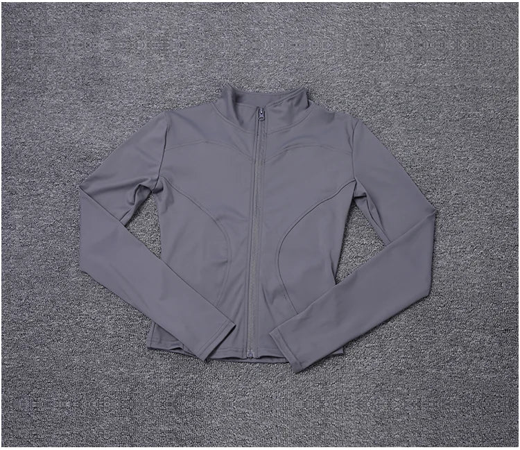 Grey polyester fitted long sleeve sport jacket with a zip front for gym training or yoga.