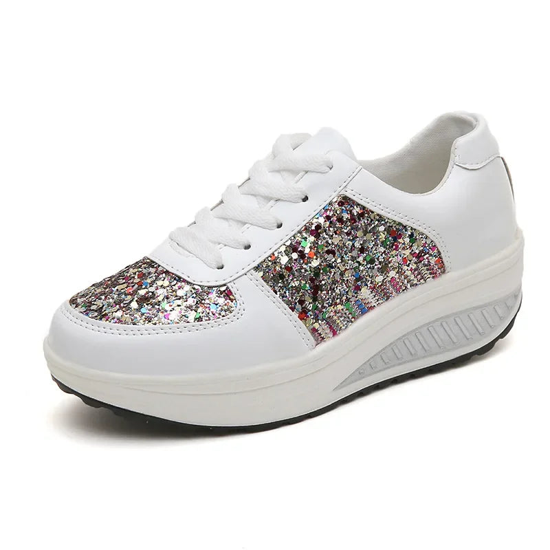 White leather lace-up platform sneaker with multicolored glitter panels on the toe and side.