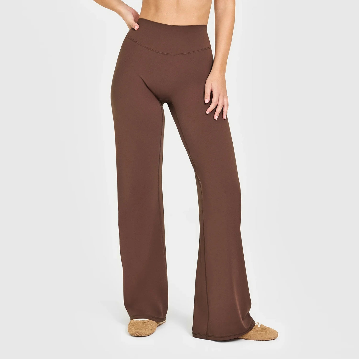 Dark brown high waist sculpting leggings in a seamless knit fabric for workouts.