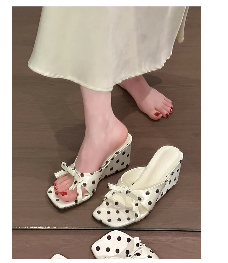 White wedge sandals with black polka dots, bow detail, and PU insole for casual wear.
