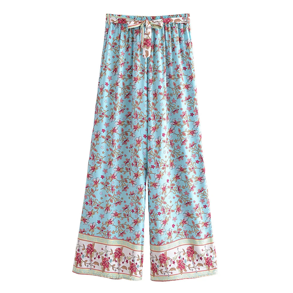 Light blue floral print flowy wide leg drawstring pants for a bohemian vacation look.